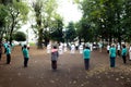 Asian elderly people practicing Tai Chi at public park